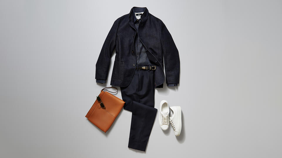 Loro Piana denim Spagna jacket in CashDenim, $5,250; Hermès indigo denim shirt, $1,100; Herno cotton-pique T-shirt, $225; Prada wool pants, $1,690; Celine Homme by Hedi Slimane smooth calfskin belt, $590; Tod’s document holder in leather, $1,045; Lacoste metal sunglasses, $209; Manolo Blahnik calf-leather low-cut sneakers, $695. 