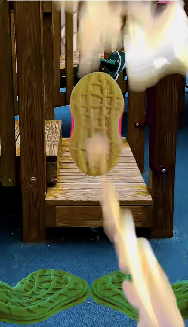 Shoe sole crushing peanut butter cup on playground equipment as a slow-motion effect emphasizes the impact, highlighting a viral internet video scene