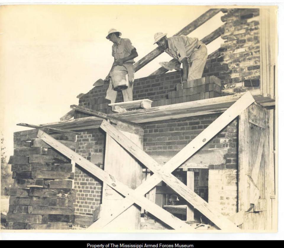 German prisoners of war laying bricks as part of a work detail. Colonel T.B. Birdsong./Mississippi Armed Forces Museum.