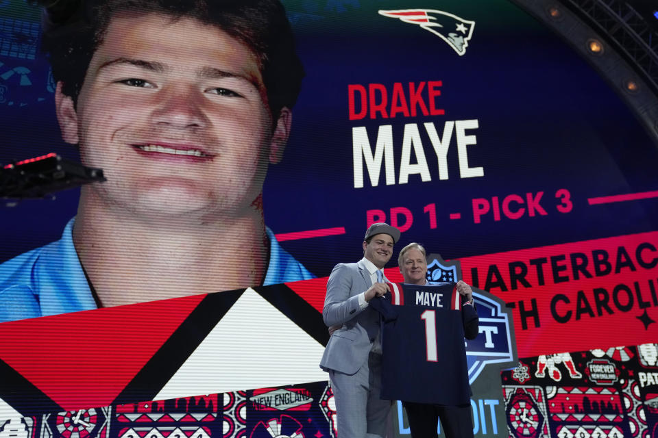 North Carolina quarterback Drake Maye poses with NFL commissioner Roger Goodell after being chosen by the New England Patriots with the third overall pick during the first round of the NFL football draft, Thursday, April 25, 2024, in Detroit. (AP Photo/Jeff Roberson)