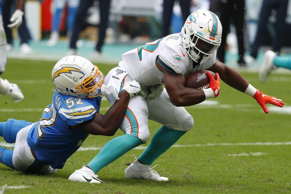 Chargers defensive end Melvin Ingram tackles Miami Dolphins running back Mark Walton.