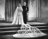 <p>Princess Elizabeth and Lieutenant Philip Mountbatten at Buckingham Palace after their wedding ceremony on 20 November 1947. They became the Duke and Duchess of Edinburgh. (Getty)</p> 