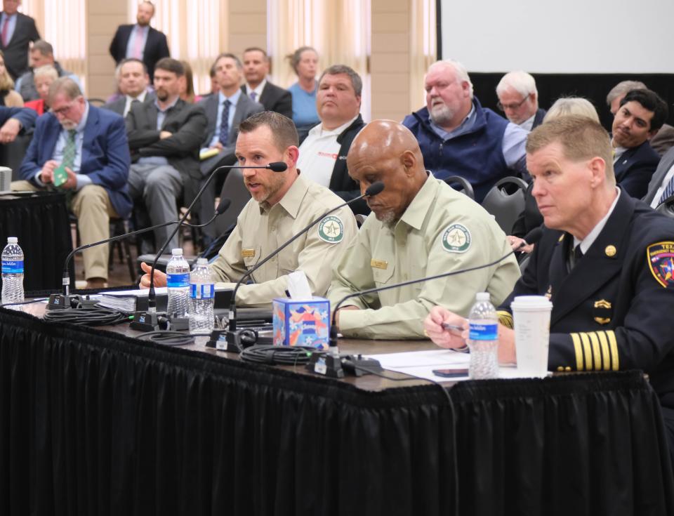 Wes Moorehead (left), associate director and fire chief of the Texas A&M Forest Service, addresses the Panhandle Wildfire Investigative Committee Tuesday in Pampa.