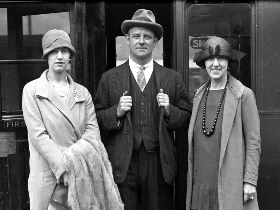 P.G. Wodehouse, with his wife Ethel (right) and daughter Leonora in 1929 boarding a train