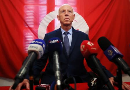 Presidential candidate Kais Saied speaks as he attends a news conference after the announcement of the results in the first round of Tunisia's presidential election in Tunis