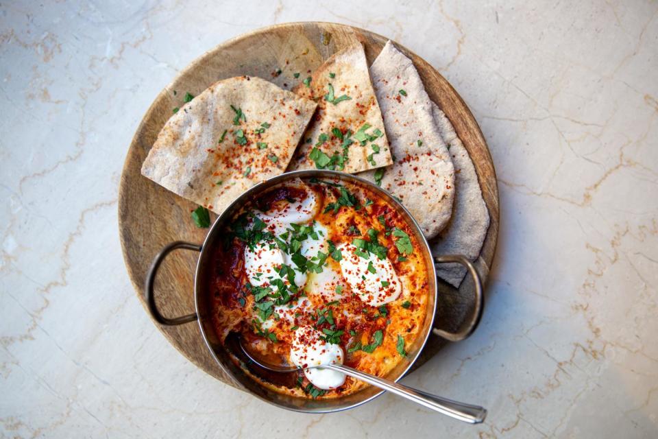 A spicy start: A popular brunch dish of spiced baked eggs at Caravan