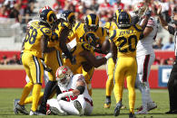 <p>Los Angeles Rams linebacker Trevon Young (49) celebrates with teammates after recovering a fumble against the San Francisco 49ers during the first half of an NFL football game in Santa Clara, Calif., Sunday, Oct. 21, 2018. (AP Photo/Tony Avelar) </p>