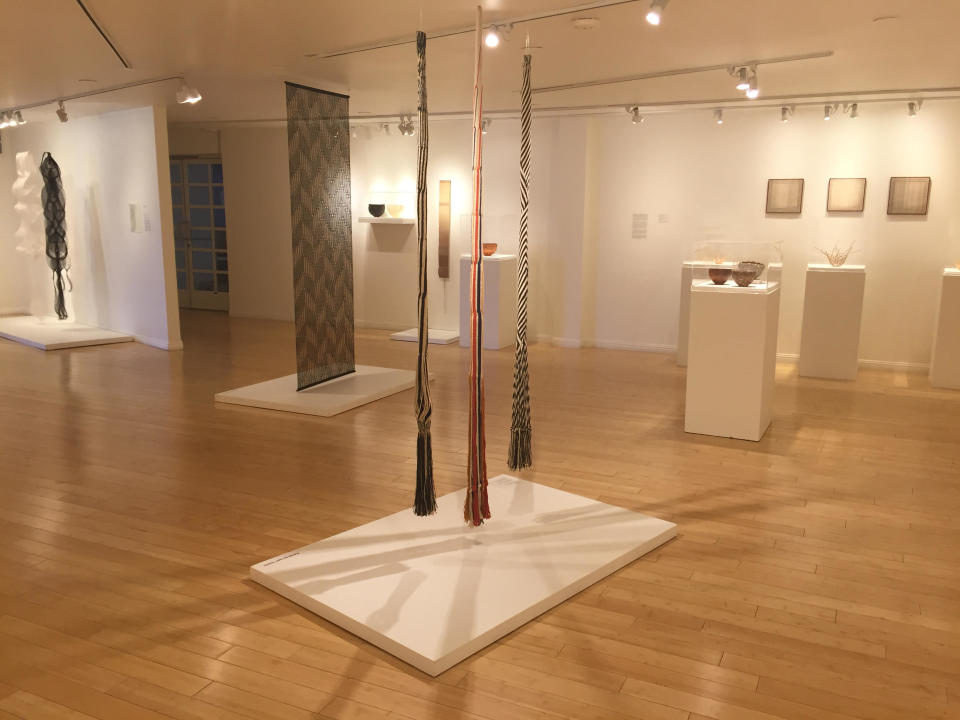 This photo taken on Dec. 2, 2016 at the Craft and Folk Art Museum in Los Angeles shows part of the "Kay Sekimachi: Simple Complexity" exhibit there, chronicling the decades-long career of Berkeley, Calif., based 90-year-old fiber artist and weaver Kay Sekimachi. The exhibit opened on Sept. 25, 2016, and runs through Jan. 8, 2017. (Solvej Schou via AP)