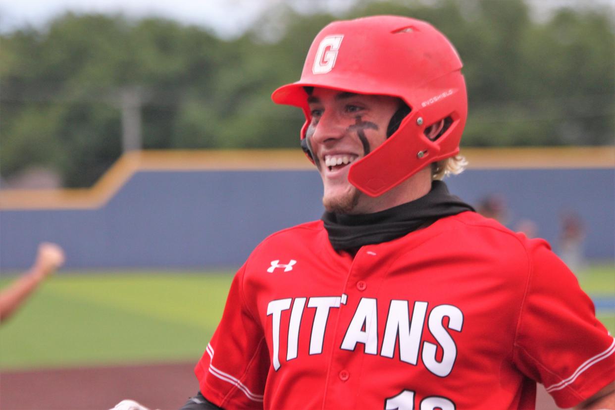 Chatham Glenwood senior catcher Will Plattner returns to the dugout all smiles during the Class 3A Decatur Supersectional against Troy Triad at Workman Family Baseball Field on Monday, June 6. Glenwood won 3-0.