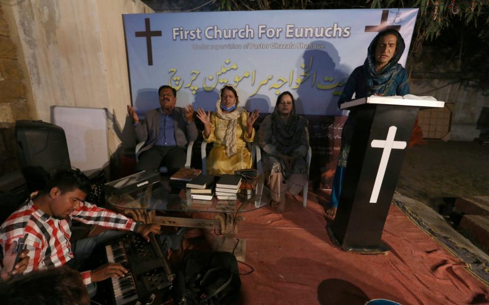 Nisara Gill, right, leads a prayer service - Fareed Khan /AP