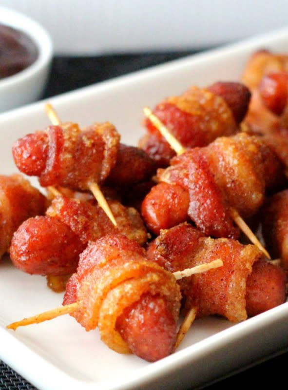 <p>Melissa's Southern Style Kitchen</p><p>The cute meat appetizer you want and need to make for the party. </p><p><strong>Get the recipe:</strong> <a href="https://www.melissassouthernstylekitchen.com/bacon-wrapped-brown-sugar-smokies/" rel="nofollow noopener" target="_blank" data-ylk="slk:Bacon Wrapped Brown Sugar Smokies;elm:context_link;itc:0;sec:content-canvas" class="link "><strong>Bacon Wrapped Brown Sugar Smokies</strong></a></p>