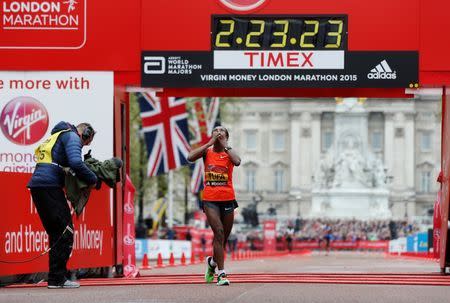 Athletics - Virgin Money London Marathon - London - 26/4/15 Ethiopia's Tigist Tufa celebrates after winning the Women's Elite race Reuters / Suzanne Plunkett Livepic