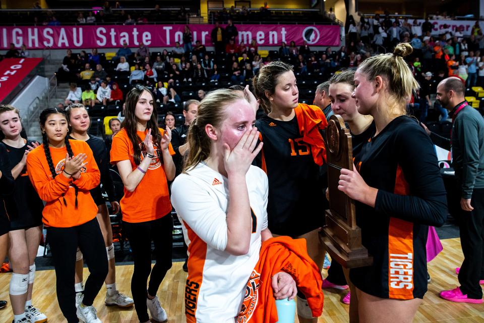 West Des Moines Valley players hold their state semifinalist trophy after a loss against Pleasant Valley on Wednesday.