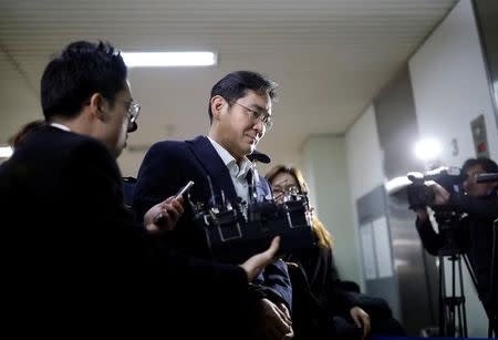 FILE PHOTO: Samsung Group chief, Jay Y. Lee arrives at the office of the independent counsel team in Seoul, South Korea, February 19, 2017. REUTERS/Kim Hong-Ji/File Photo