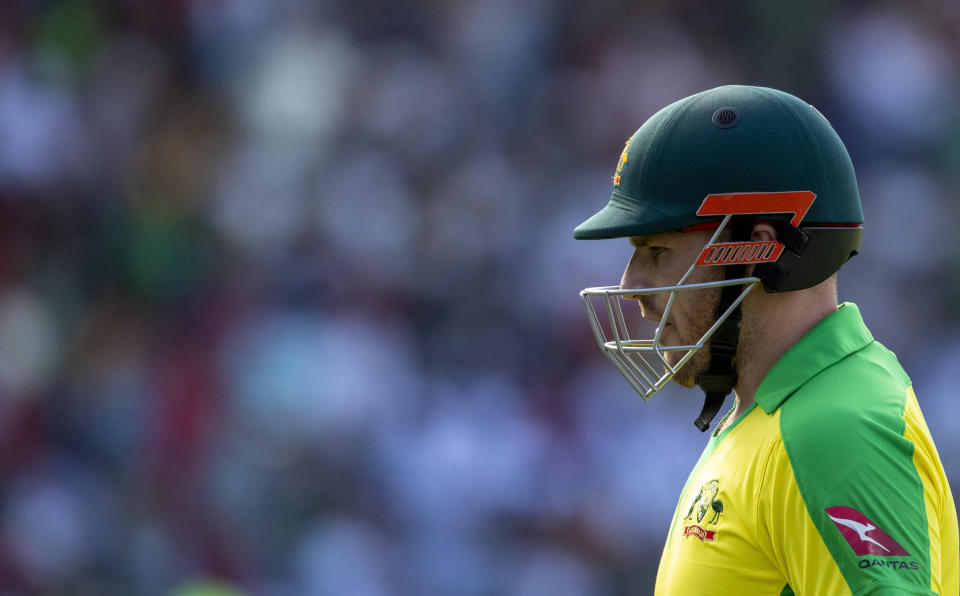 Australia's captain Aaron Finch leaves the field after bowled by South Africa's bowler Lungi Ngidi for 14 runs during the 2nd T20 cricket match between South Africa and Australia at St George's Park in Port Elizabeth, South Africa, Sunday, Feb. 23, 2020. (AP Photo/Themba Hadebe)