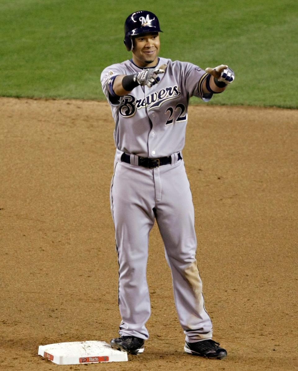 Milwaukee Brewers outfielder Jody Gerut acknowledges the dugout after hitting a double for the cycle during the ninth inning.