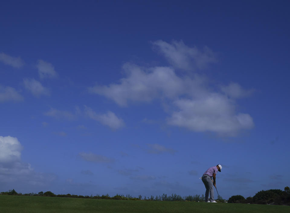 Xander Schauffele, of the United States, looks down to watch his ball on the 7th green during the second round of the Hero World Challenge PGA Tour at the Albany Golf Club in New Providence, Bahamas, Friday, Dec. 2, 2022. (AP Photo/Fernando Llano)