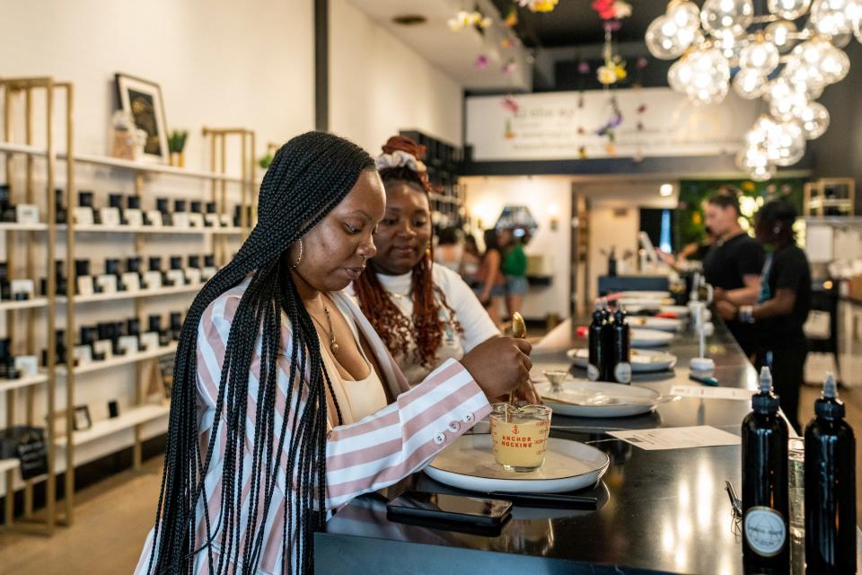 Nyree Williams and her daughter Natavia Williams mix up scents at Alchemy Scent Bar in Montclair, NJ on Friday, May 12, 2023. Alchemy Scent Bar is a store where customers mix and curate their own scents, and turn them into lotions, soaps and candles. 