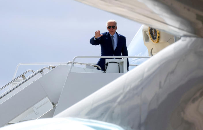 U.S. President Joe Biden waves as he boards Air Force One for travel back to Washington from Harry Reid International Airport in Las Vegas, Nevada, U.S., March 15, 2023. REUTERS/Leah Millis