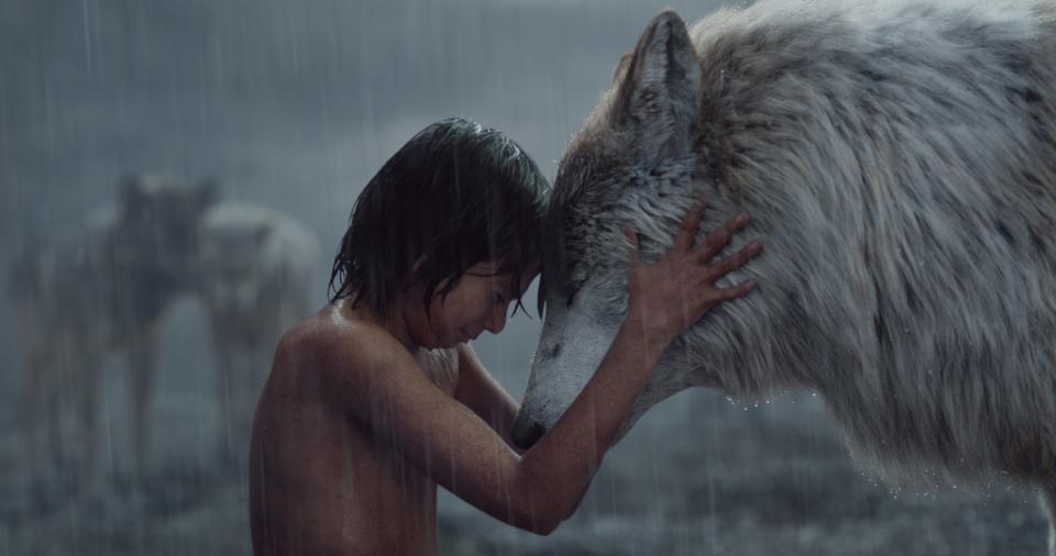 Mowgli (Neel Sethi) shares a moment with his wolf mom Raksha (voiced by Lupita Nyong'o), one of the many photorealistic animals in Jon Favreau's "The Jungle Book.'