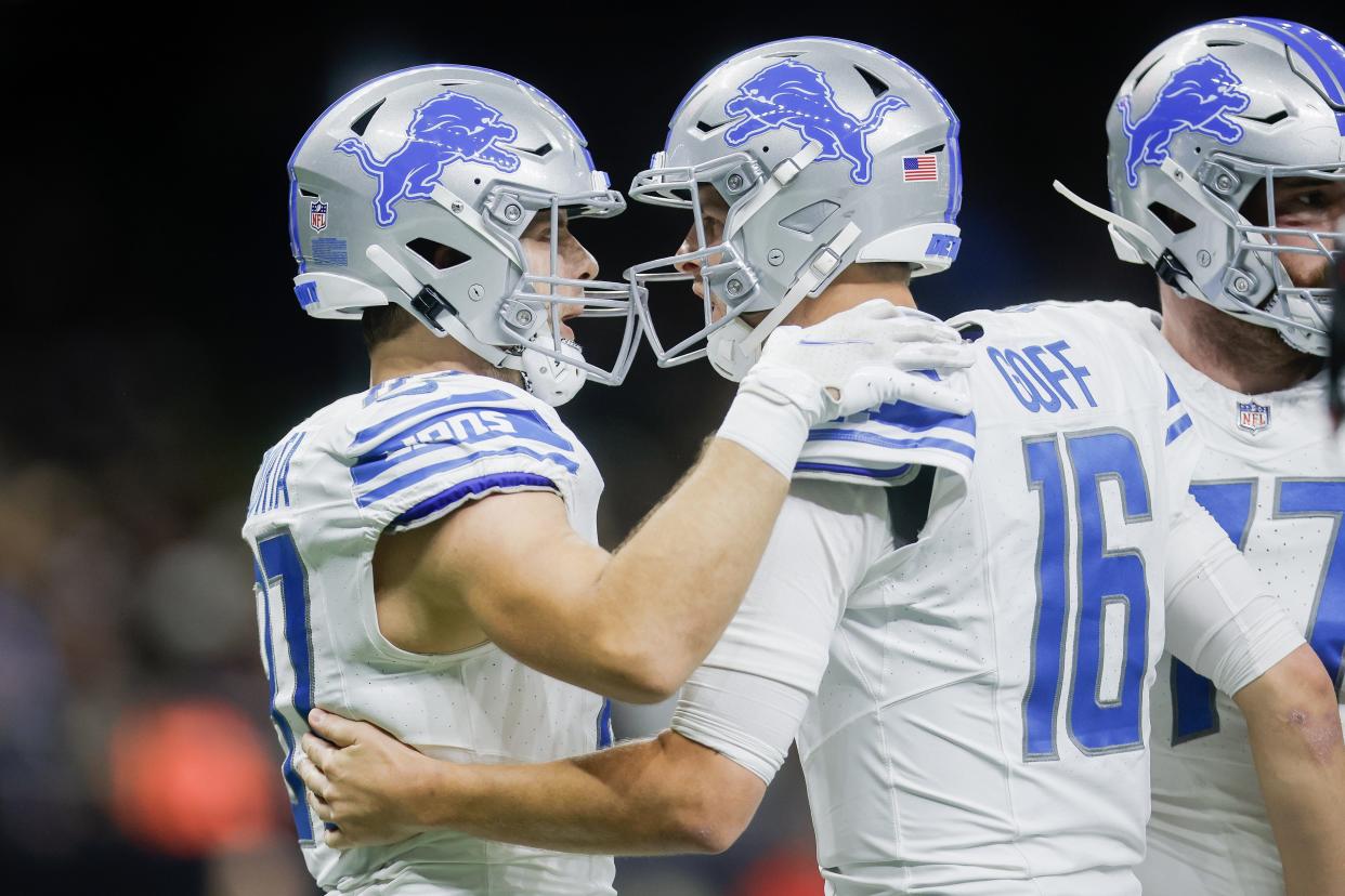 Lions tight end Sam LaPorta, left, and quarterback Jared Goff celebrate after scoring a touchdown during the first half on Sunday, Dec. 3, 2023, in New Orleans.