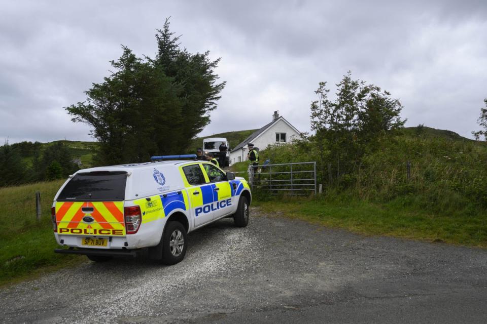 Police at the scene of the incident in Tarskavaig, Skye (John Linton/PA) (PA Wire)