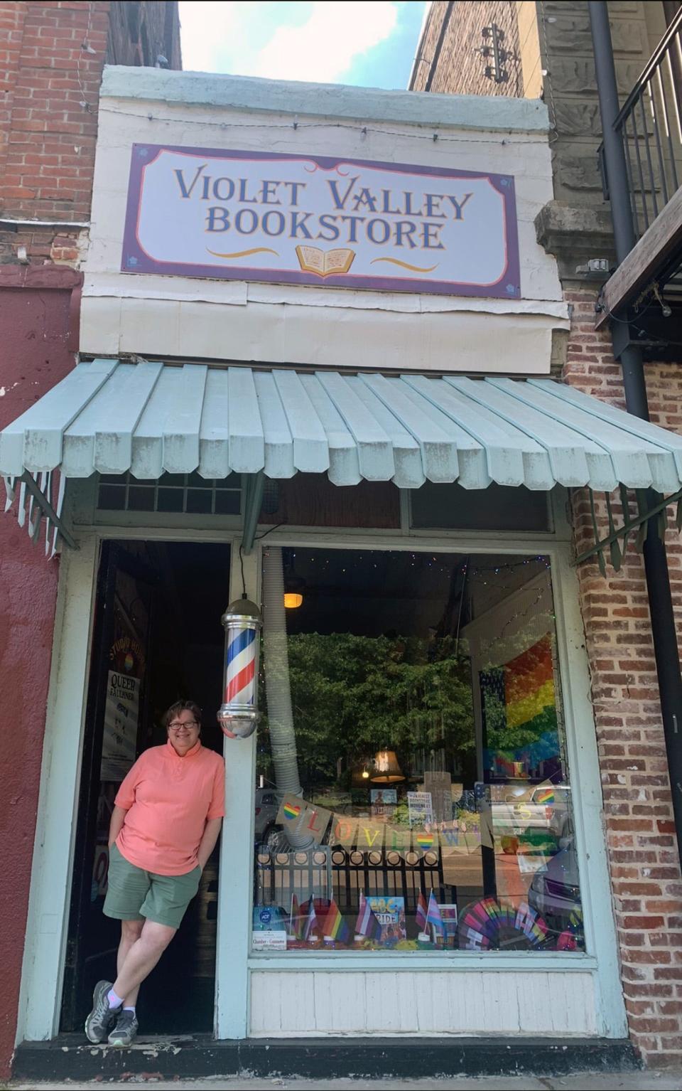 Jaime Harker, founder and owner of Violet Valley Bookstore stands outside the Water Valley, Miss. store Saturday, June 24, 2023. Harker said laws seeking to limit who transgender people can room with in college or prisons does nothing but potentially put trans people in danger.