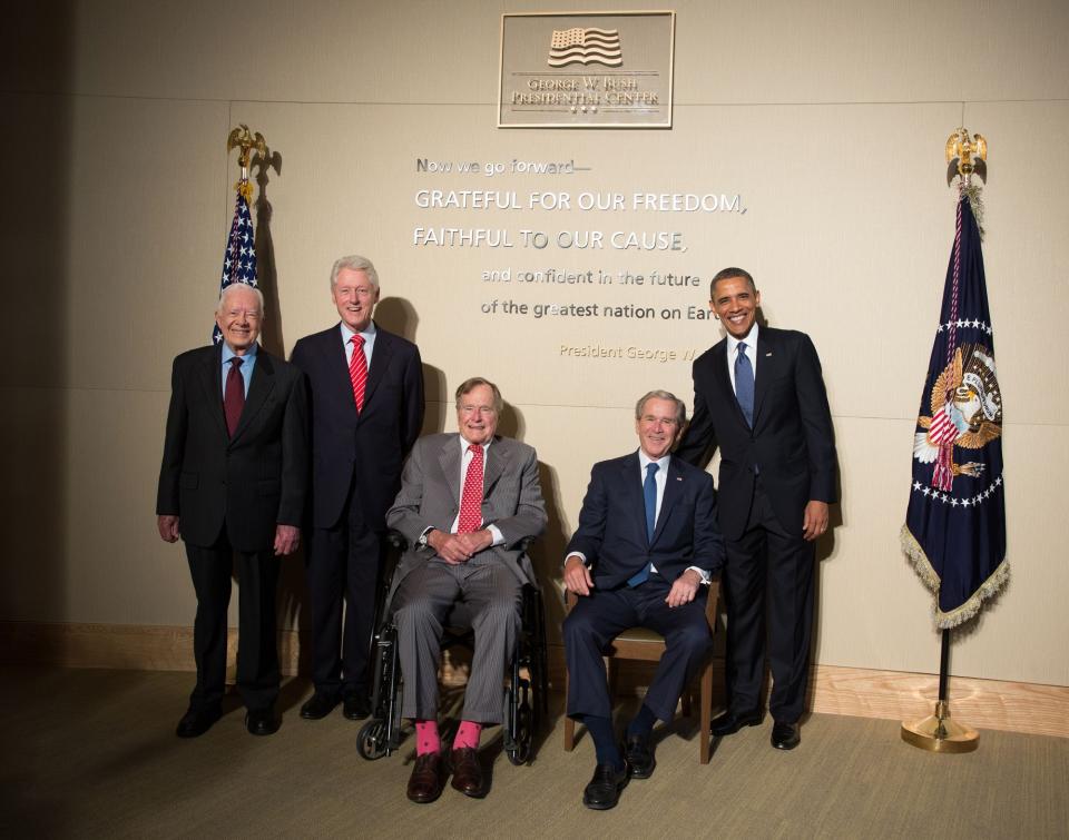 In this handout photo taken on April 25, 2013, and released by George W. Bush Presidential Center, former U.S. Presidents from left, Jimmy Carter, Bill Clinton, George H. W. Bush, George W. Bush pose with President Barack Obama for a group photo at the George W. Bush Library in Dallas, Texas. 