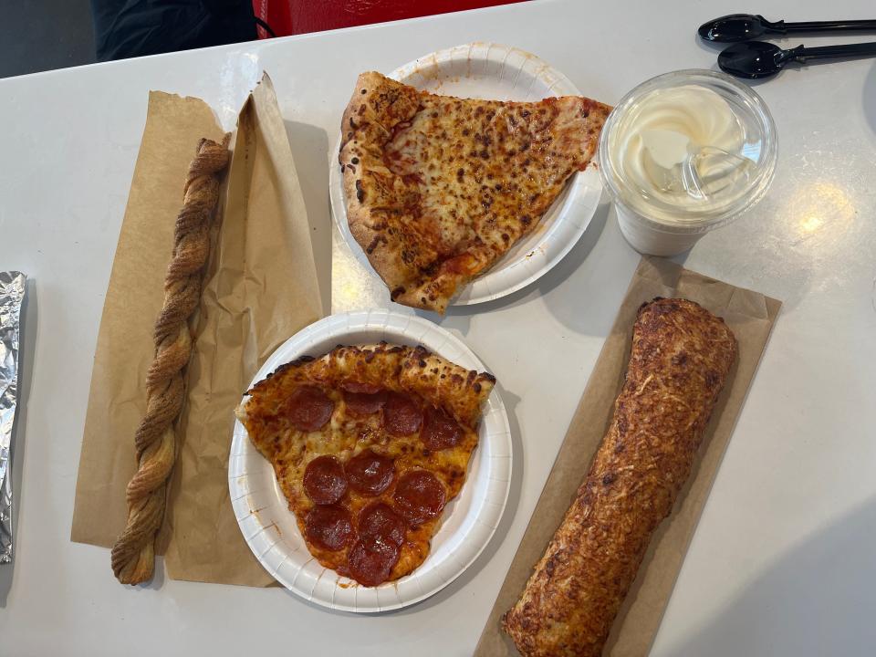 Churro, chicken bake, cheese and pepperoni pizza, and ice cream at US Costco food court