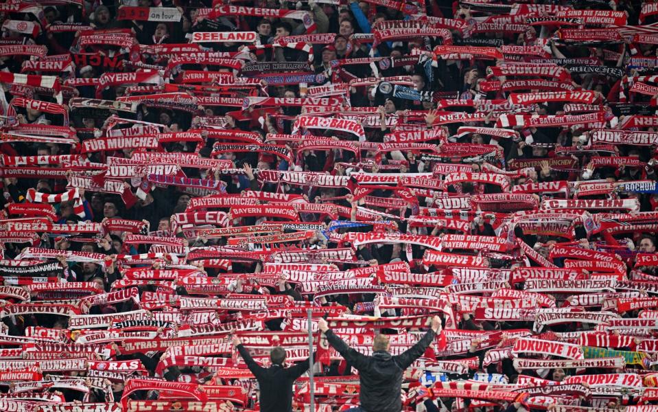 Bayern Munich fans with scarves - Matthias Hangst/GETTY