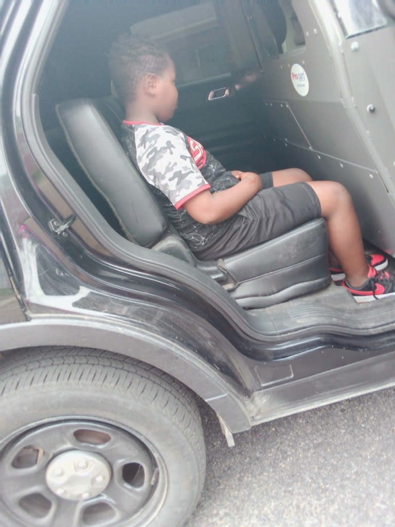 Latonya Eason took this photo of her son Quantavious after he was placed in the back of a police car after his arrest. (Courtesy of Carlos Moore)