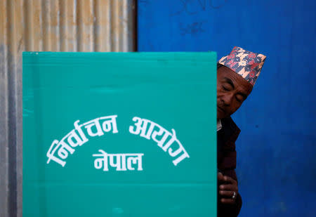 An officer from election commission works to set up a polling station during the parliamentary and provincial elections at Chautara in Sindhupalchok District November 26, 2017. REUTERS/Navesh Chitrakar