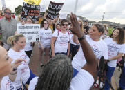 FILE - In this June 7, 2021, file photo, people gather in Baytown, Texas, to protest Houston Methodist Hospital system’s policy that says hospital employees must get vaccinated against COVID-19 or lose their jobs. A federal judge dismissed their lawsuit, saying if workers don’t like the rule, they can go find another job. (Yi-Chin Lee/Houston Chronicle via AP)