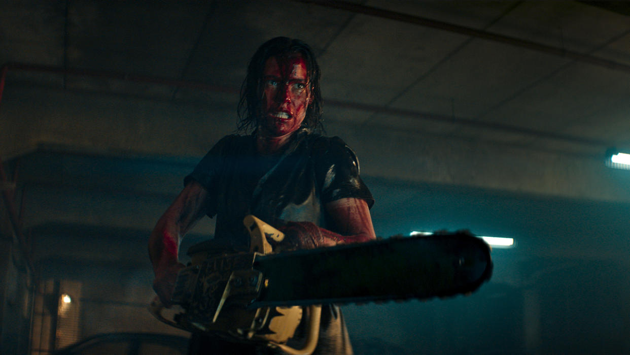  Beth (Lily Sullivan) with chainsaw in Evil Dead Rise 