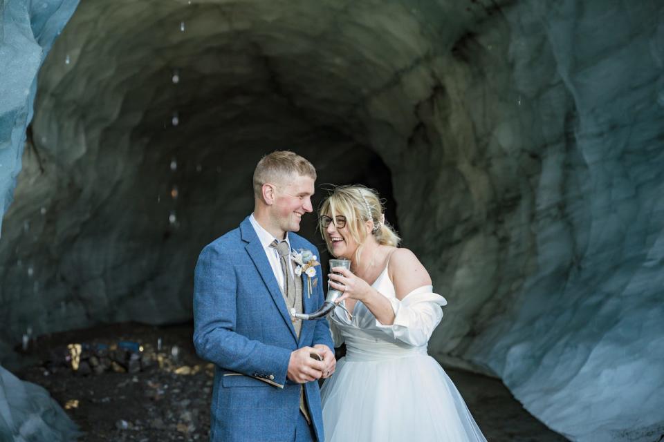 A bride and groom celebrating with Icelandic moonshine.