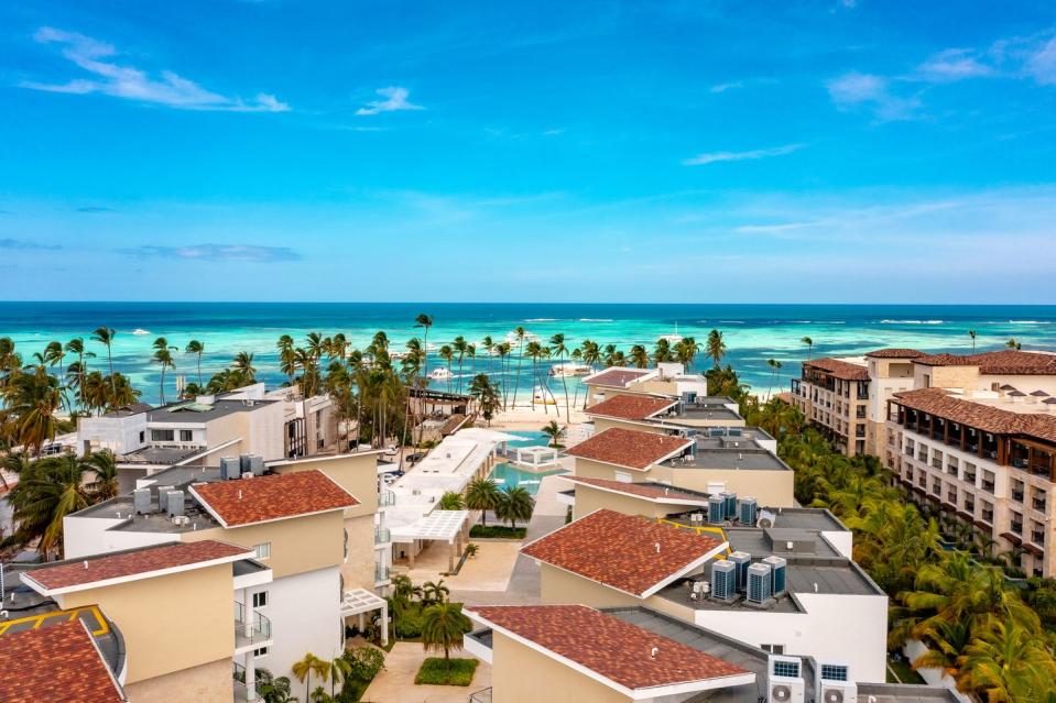 luxurious exterior design of tropical complex with pools and buildings punta cana, dominicana dron