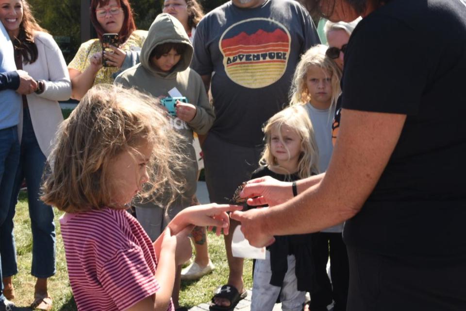 Young volunteers help tag and release monarch butterflies with biologist Jackie Taylor during a free event at Twin Oast in Catawba on Sept. 23.