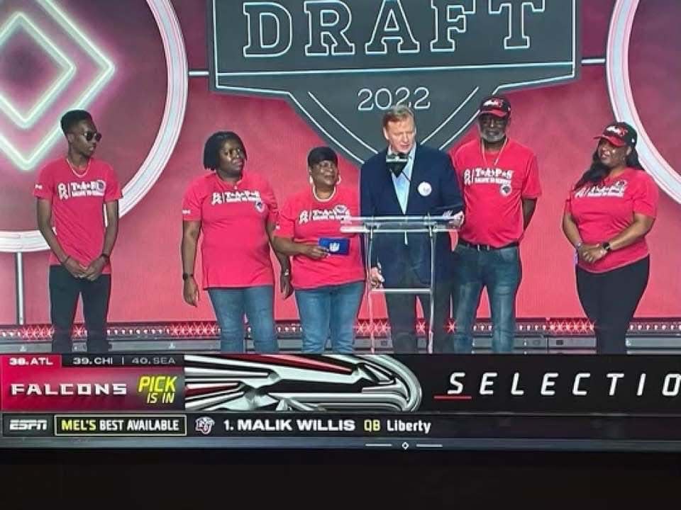 South Effingham track athlete Karistopher Gadsden (far left) is on stage at the Bellagio Hotel & Casino fountain in Las Vegas on April 29 as his late father Clifford Valentino Gadsden, who died in Iraq, is honored at the NFL draft. Karistopher's grandmother Minerva Gadsden (to the right of NFL commissioner Roger Goodell) announced the Atlanta Falcons' second-round selection.