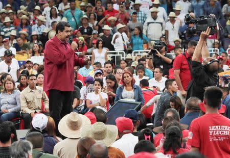 Venezuela's President Nicolas Maduro (L) speaks during a gathering in support of him and his proposal for the National Constituent Assembly in Caracas, Venezuela June 27, 2017. Miraflores Palace/Handout via REUTERS