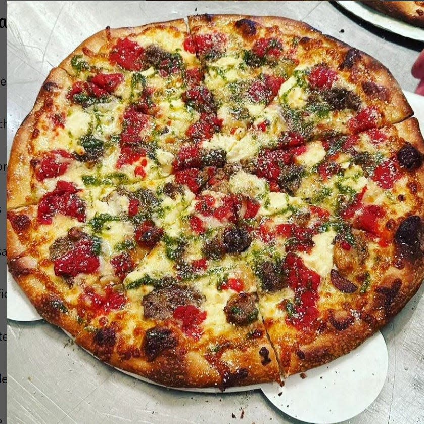 The Meatball pizza with a garlic base, house meatballs, basil pesto, garlic oil and mozzarella, provolone, whipped ricotta and Romano cheeses from Bazemore Pizza Co.