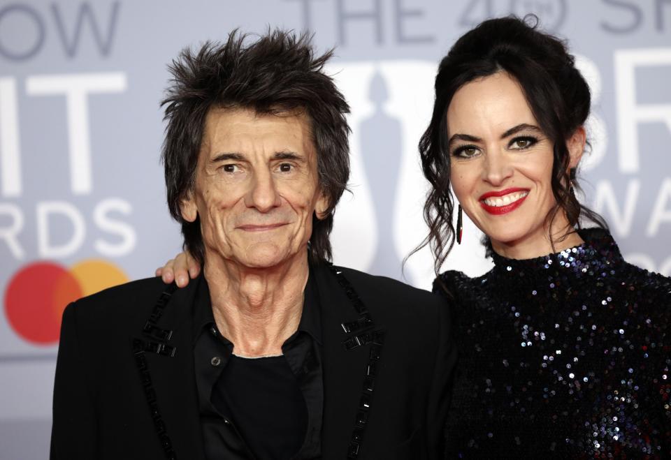 Ronnie Wood and Sally Humphreys pose for photographers upon arrival at Brit Awards 2020 in London, Tuesday, Feb. 18, 2020.(Photo by Vianney Le Caer/Invision/AP)