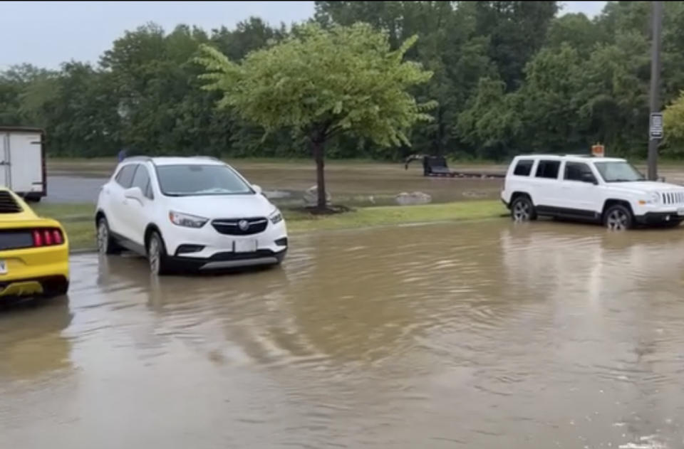 A parking lot is flooded after heavy rain passed the area on Wednesday, July 19, 2023 in Paducah, Ky. The National Weather Service issued flash flood watches and warnings, estimating that as much as 10 inches (25 centimeters) of rain could fall in the area where Kentucky, Illinois and Missouri meet at the convergence of the Mississippi and Ohio rivers. (Courtesy of Marilyn Gabel via AP)