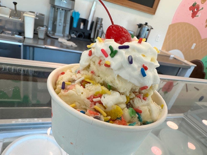 A Fruity Pebbles ice cream topped with whipped cream, sprinkles and a cherry from Totes Ice Cream, 1714 SE Hawthorne Road, in Gainesville