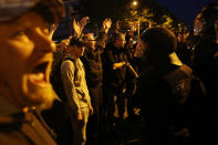 <p>Participants in a right-wing march confront riot police after police halted the march due to a blockade by counter-demonstrators on Sept. 1, 2018 in Chemnitz, Germany. Several thousand people had taken part in a march of silence organized by the right-wing Alternative for Germany (AfD) political party. Two refugees, a Syrian and an Iraqi, are accused of having stabbed Chemnitz local Daniel Hillig following an altercation in the early hours of August 26. The death has sparked angry protests by locals as well as right-wing groups that have led to clashes with police and counter-protesters. (Photo: Sean Gallup/Getty Images) </p>