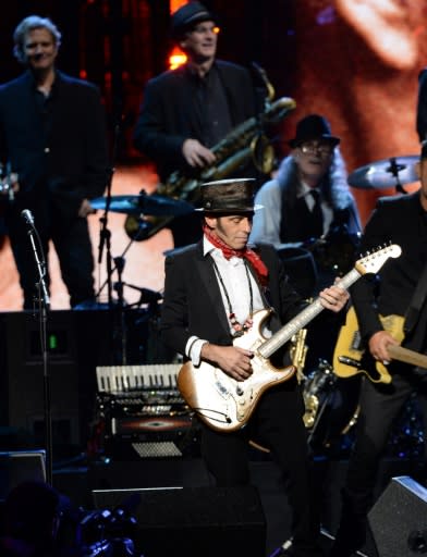 Nils Lofgren, here performing with Bruce Springsteen's E Street Band at the 29th Annual Rock And Roll Hall Of Fame Induction Ceremony in April 2014, teamed back up with Neil Young and Crazy Horse for the rocker's latest album