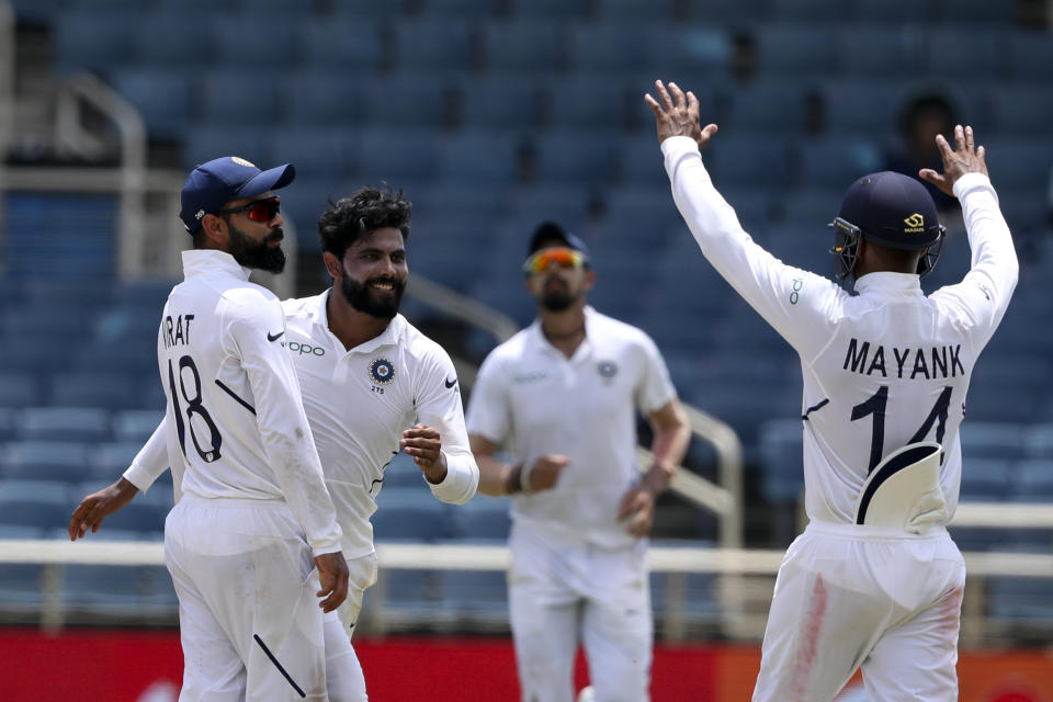 India's Ravindra Jadeja, second from left, celebrates taking the wicket of West Indies' Jahmar Hamilton during day four of the second Test cricket match at Sabina Park cricket ground in Kingston, Jamaica Monday, Sept. 2, 2019. (AP Photo/Ricardo Mazalan)
