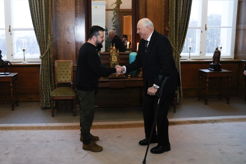 Ukrainian President Volodymyr Zelenskyy is received by Norway's King Harald, at the Royal Palace in Oslo, Wednesday, Dec. 13, 2023. (Fredrik Varfjell/NTB Scanpix via AP)
