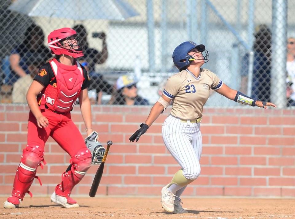 Central Catholic’s Miranda Temple (23) watches the ball fly after hitting a deep fly ball to center field during a game between Oakdale and Central Catholic at Oakdale High School in Oakdale, Calif. on April 17, 2024. Central Catholic won 6-2.