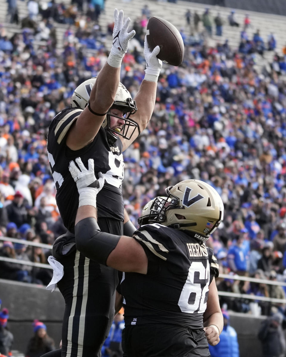 Vanderbilt tight end Ben Bresnahan, left, celebrates with Julian Hernandez (62) after Bresnahan scored a touchdown against Florida in the second half of an NCAA college football game Saturday, Nov. 19, 2022, in Nashville, Tenn. Vanderbilt won 31-24. (AP Photo/Mark Humphrey)