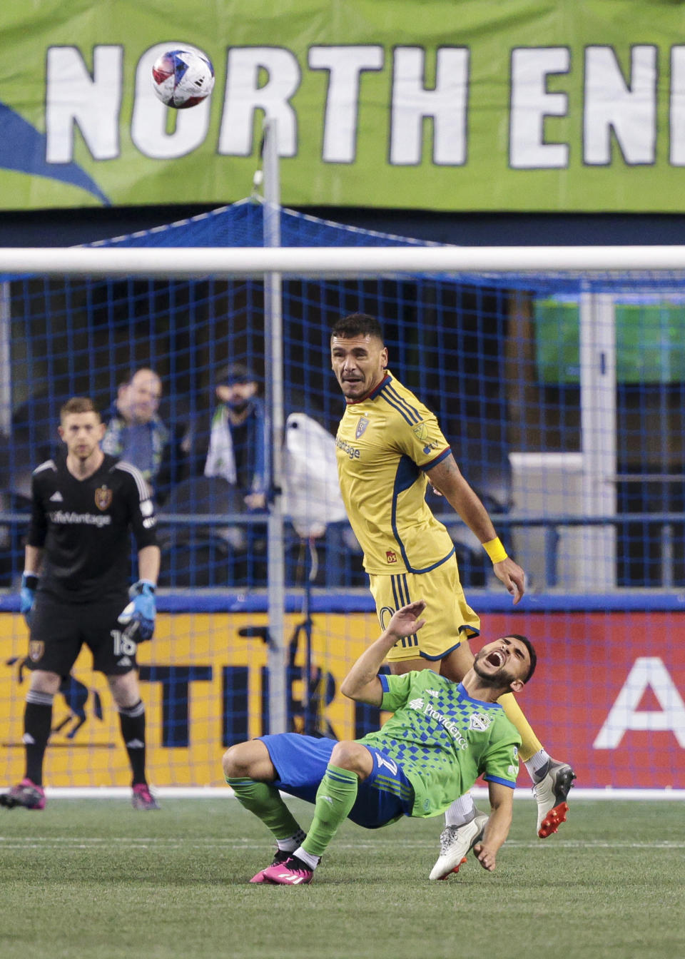 Real Salt Lake defender Marcelo Silva, top, watches the ball after heading it away from falling Seattle Sounders midfielder Cristian Roldan during the first half of an MLS soccer match Saturday, March 4, 2023, in Seattle. (AP Photo/Jason Redmond)